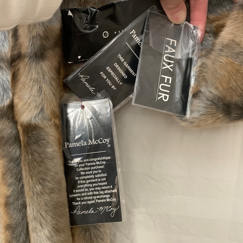 Faux coyote fur coat couture styling.
